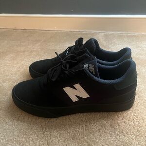 New Balance Men's Black and White Sneakers